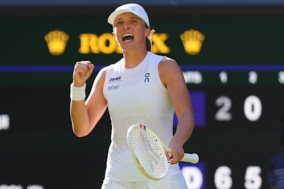 Iga Swiatek of Poland celebrates after winning her match against Belinda Bencic of Switzerland.