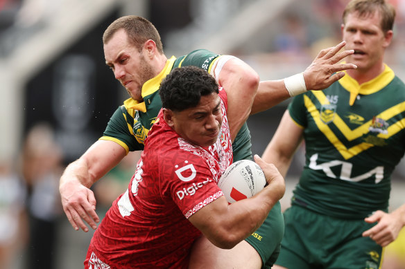 Tonga’s Jason Taumalolo breaks through the Kangaroos line.
