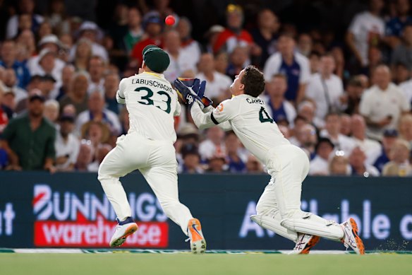 Alex Carey takes the catch despite pressure from Marnus Labuschagne.