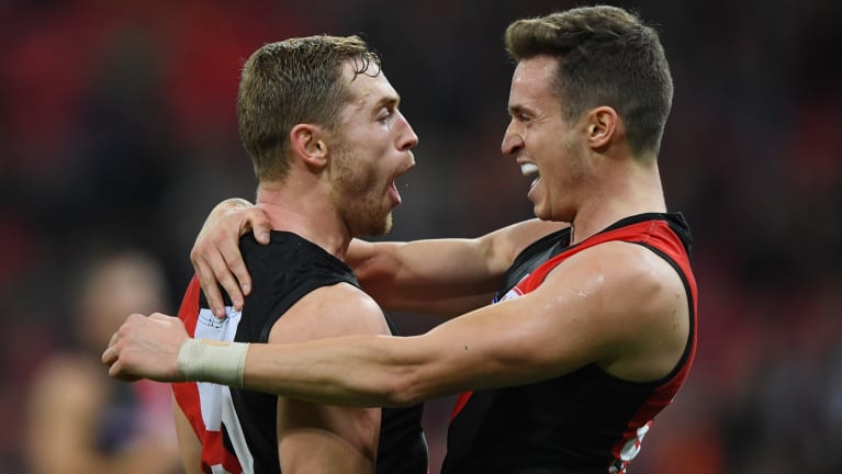 Devon Smith and Orazio Fantasia celebrate.