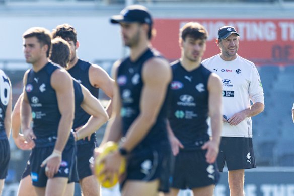 Interim coach Josh Frser (right) oversees Carlton training on Wednesday, the day after the departure of Michael Voss as senior coach.