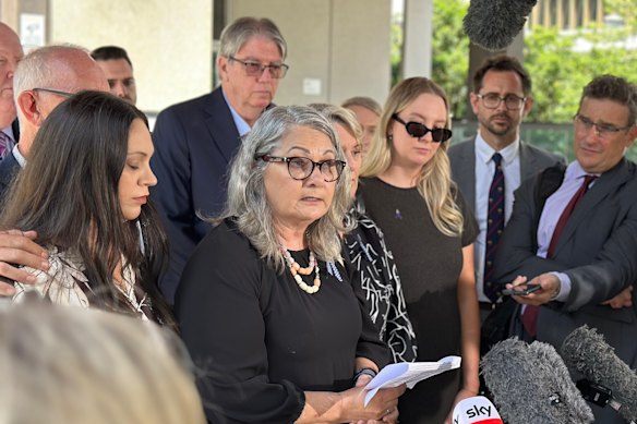 The families of Rachel McCrow and Matthew Arnold, led by Judy McCrow, outside Brisbane Magistrates Court after State Coroner Terry Ryan handed down his findings into the Wieambilla ambush.
