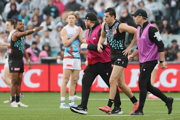 Josh Sinn of the Power comes off injured.