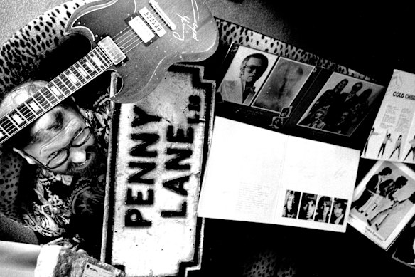 Baker in his record shop Time Warp with some of the rock relics he was auctioning in 1992.