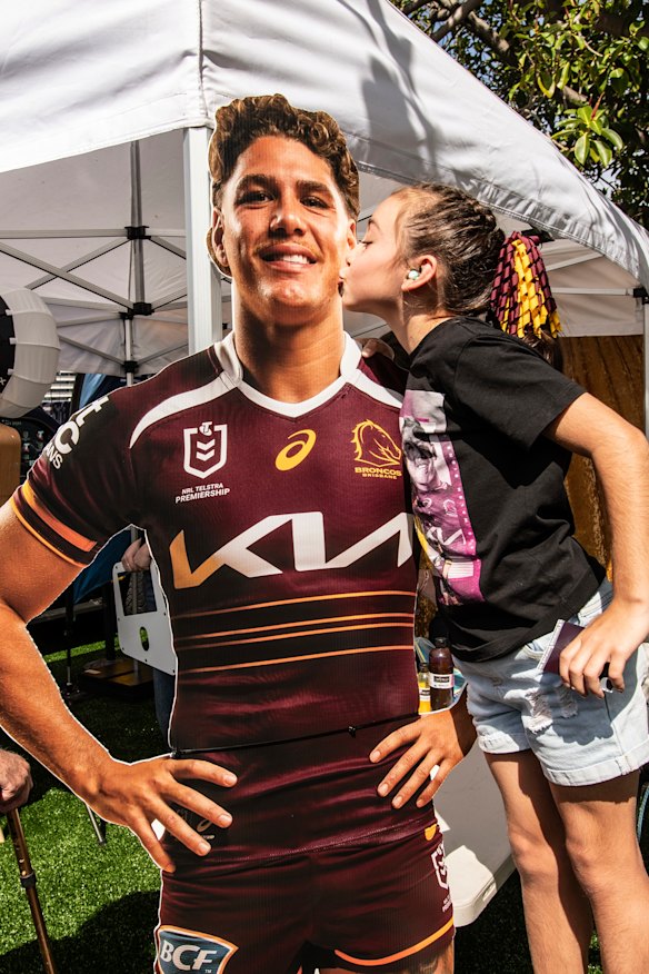 Eight-year-old Broncos supporter Mova-Jean Howlett showed her affection for cardboard cutout Reece Walsh at Thursday’s NRL Fan Fest.