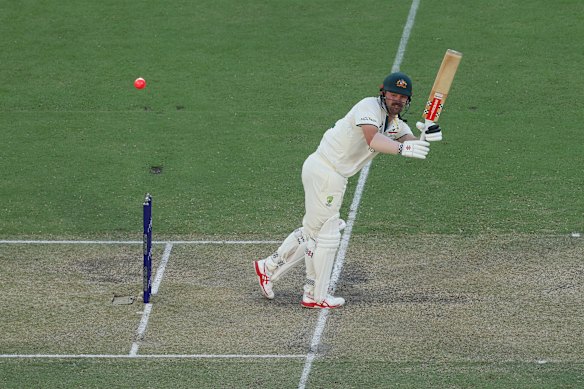 Travis Head smacks the pink ball in Adelaide.