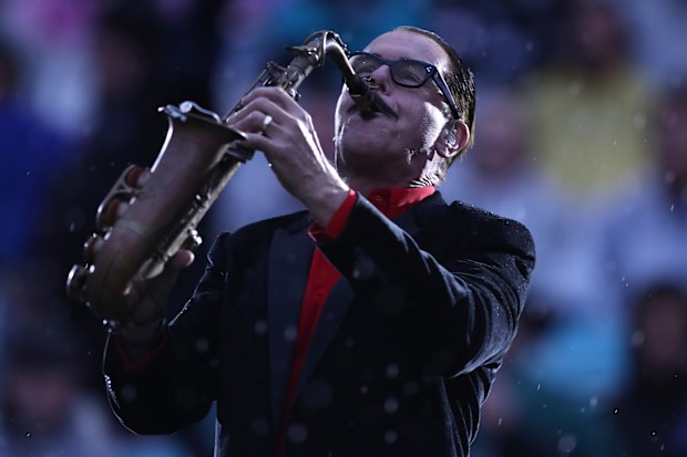 Kirk Pengilly performing with INXS at the 2020 NRL grand final.