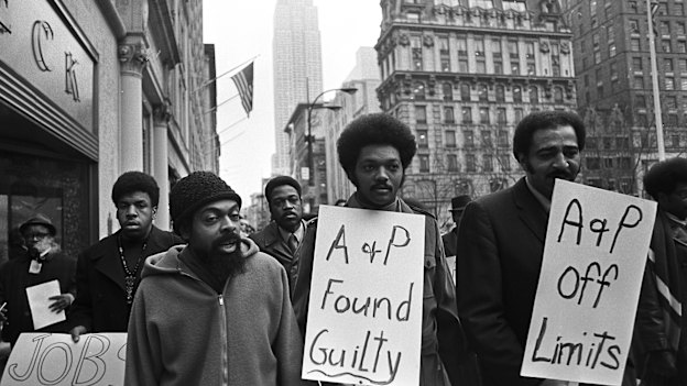 Jesse Jackson (centre) leads a protest in 1970 in New York for Operation Breadbasket, an economic development campaign.