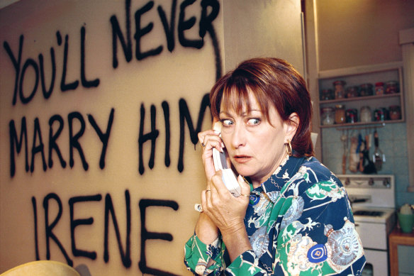 Irene (Lynne McGranger) being terrorised by Eve Smith in Home and Away in 2000.