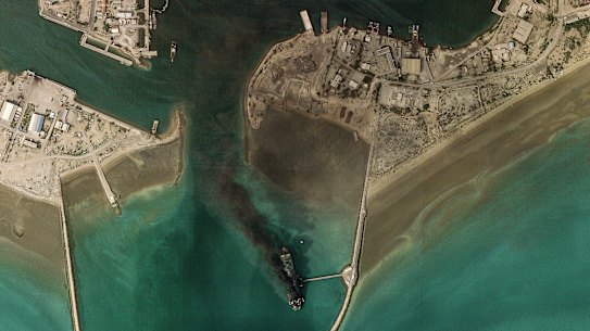 A vessel identified as the Iranian Navy’s largest ship burns at Bandar Abbas. 