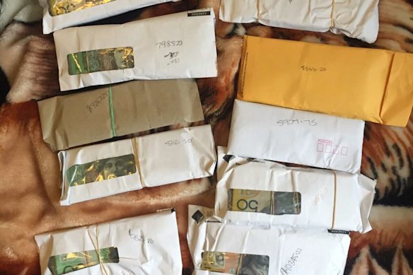 A photo of the envelopes containing bundles of cash Ibrahim Helmy sent to Adam Taki in 2015.