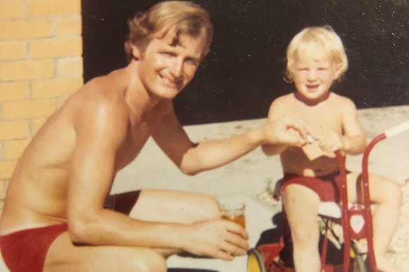 A young James Hughes with his father.  
