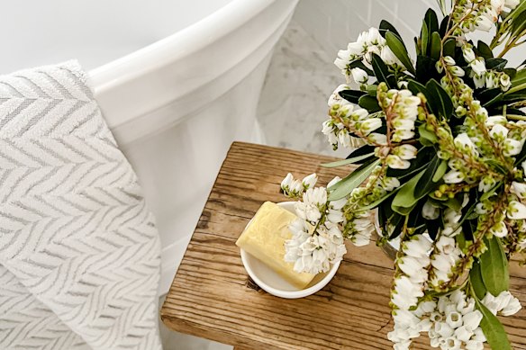 Clean towels, fresh flowers and scented soap are a good starting point for a guest-friendly bathroom.