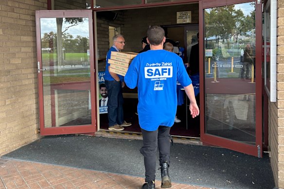 Liberal supporters - and pizza - arriving for Bruce candidate Zahid Safi’s campaign launch on Sunday evening.