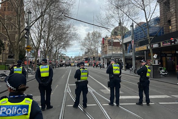 Police officers in Swanston Street as four different protests take place on Saturday across the CBD.