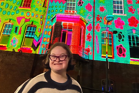 Bridget Kelly in front the ASN Clock Tower in the Rocks, on which her artwork was projected during Vivid.