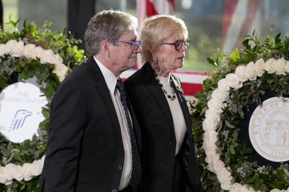 James “Chip” Carter and wife Becky after the service for his father at the Jimmy Carter Presidential Library and Museum in Atlanta on Saturday.