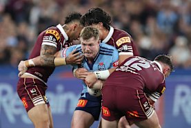 Hudson Young of the Blues is tackled.