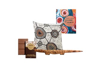 Milk chocolate with muntrie and honey, “Meeting places” cushion;  Sculpture “Ngintaka”;  Welcome to the Countryside by Marcia Langton.