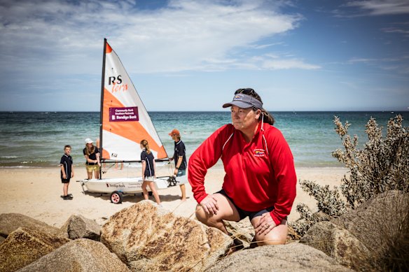 The Safety Beach Sailing Club training coordinator, Fiona Lowe at Safety Beach as young sailing club members Lewis, 8 and Iona Lowe, 12 are instructed by junior sailing instructors Nick Meijer andJess Lowe. Fiona has seen an increase in the amount of Jetski’s that come dangerously close to swimmers and sailors at the beach.
