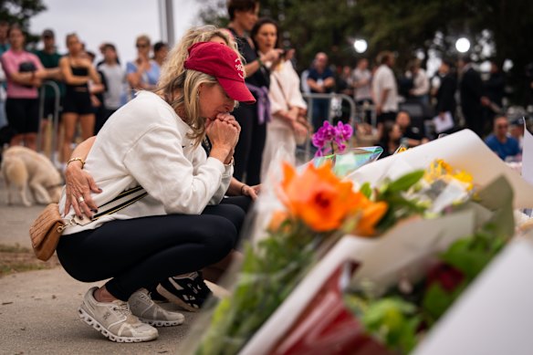 Jodie Gien visits the memorial at Bondi Pavilion, two days after the mass shooting at Bondi Beach. 