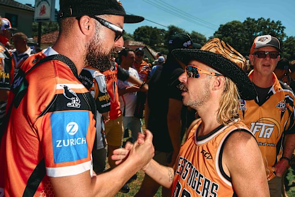 Liam Burgess (right) was the first to arrive at the rally at 8.30am.