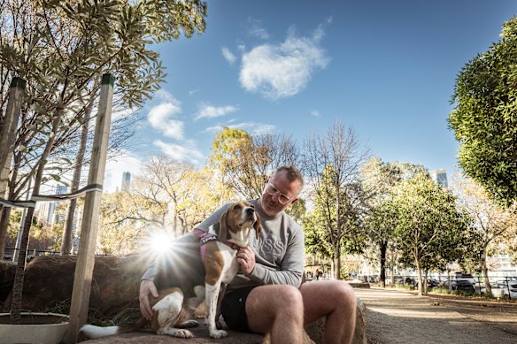 Brett Potts with his five-year-old beagle cross, Vera, at Eades dog park in West Melbourne. 