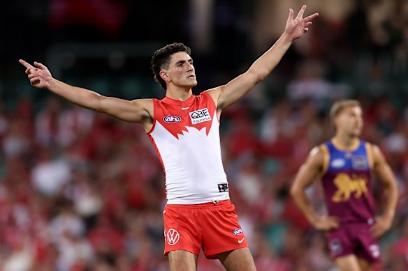 Justin McInerney celebrates kicking a goal.