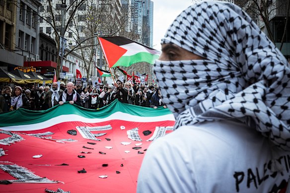 Pro-Palestinian protesters march in Melbourne’s CBD on Sunday, two days after attacks on a synagogue and an Israeli restaurant.