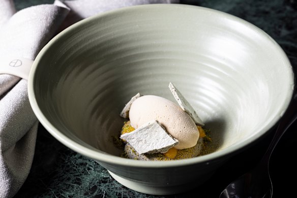Finger lime ice-cream with black sesame meringue.