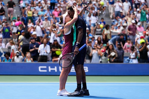 Elina Svitolina, of Ukraine, left, and Gael Monfils, of France, kiss after winning a mixed doubles match at the U.S. Open tennis championships.