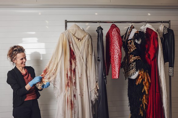 Margot Anderson with costumes featured in DIVA.