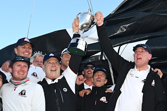 Skippers James Mayo and Matt Allen celebrate their fifth line honours win with the Comanche crew.