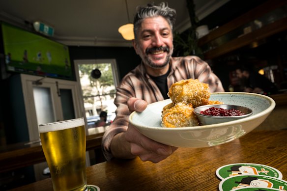 Bartender Manny Platsis with The Lincoln’s wild boar dim sims and beetroot relish.
