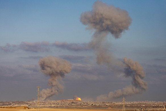 Smoke rises after explosions in the Gaza Strip as seen from a position on the Israeli side of the border on August 31.