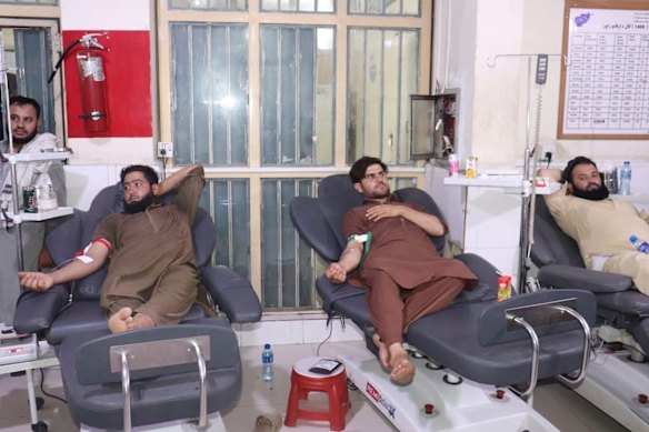 Afghans donate blood for earthquake victims in this photo released by the Ministry of Public Health.