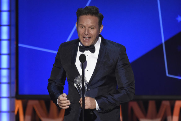 Burnett accepts the award for best reality show for The Voice at the 2016 Critics’ Choice Awards.