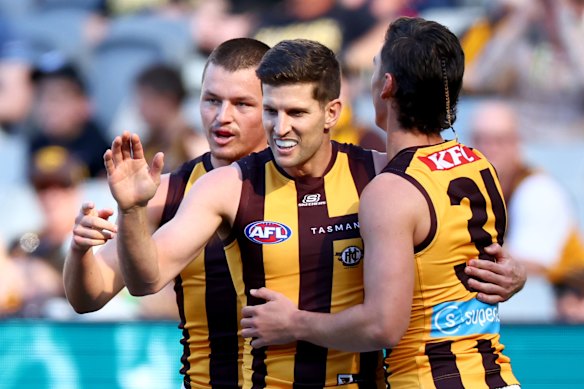 Luke Breust is congratulated for a first-quarter goal.