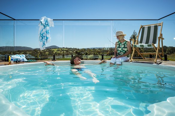 The Mennen family’s pool offers views over the landscape. 