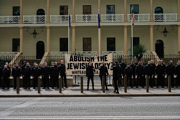 More than 60 people attended the rally, which was monitored by uniformed police. 