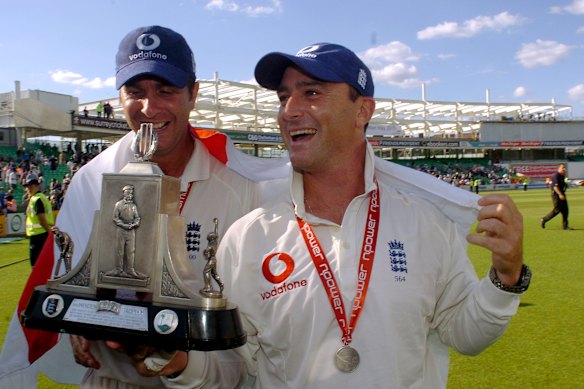 England captain Michael Vaughan, left) and Graham Thorpe celebrate after a victory.
