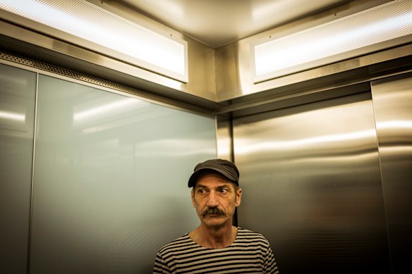 Hank Ferguson rides the lift at Holmes Court in Northcote.