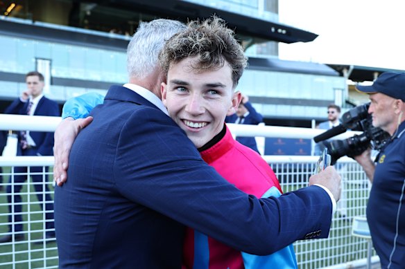 Trainer Matt Smith embraces jockey Zac Lloyd after Headwall’s win in the Concorde Stakes.