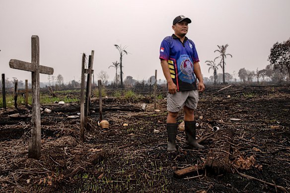 Trovimus Akoi and his neighbours fought nine-metre walls of fire in Lintang Batang.