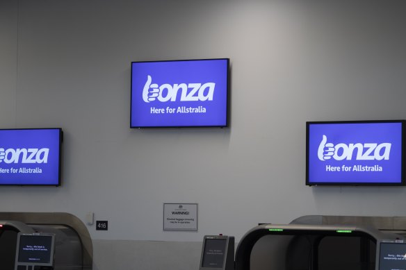 Empty Bonza work  desks astatine  Tullamarine Airport.