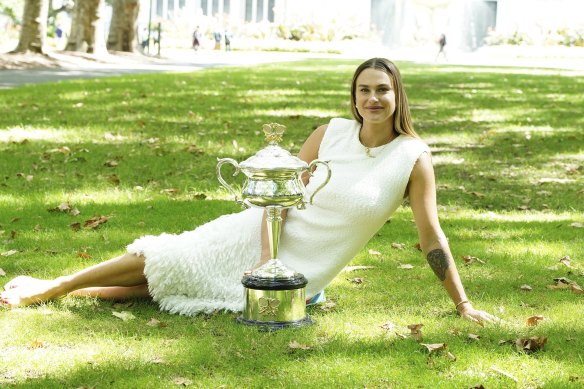 Aryna Sabalenka poses with the trophy at Carlton Gardens after winning the 2024 Australian Open women’s singles final.