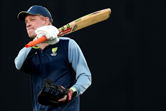 Australian cricket coach Andrew McDonald helps his side warm up before a T20 game in Darwin last month.