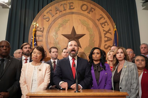 Texas Speaker Dustin Burrows (centre) at a press conference at the state Capitol in Austin.