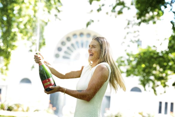 Aryna Sabalenka pops the champagne the morning after her 2024 Australian Open win.