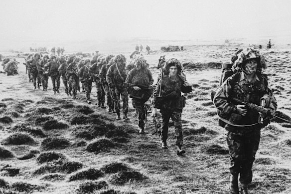 British paratroopers march across East Falkland island during the 1982 war.